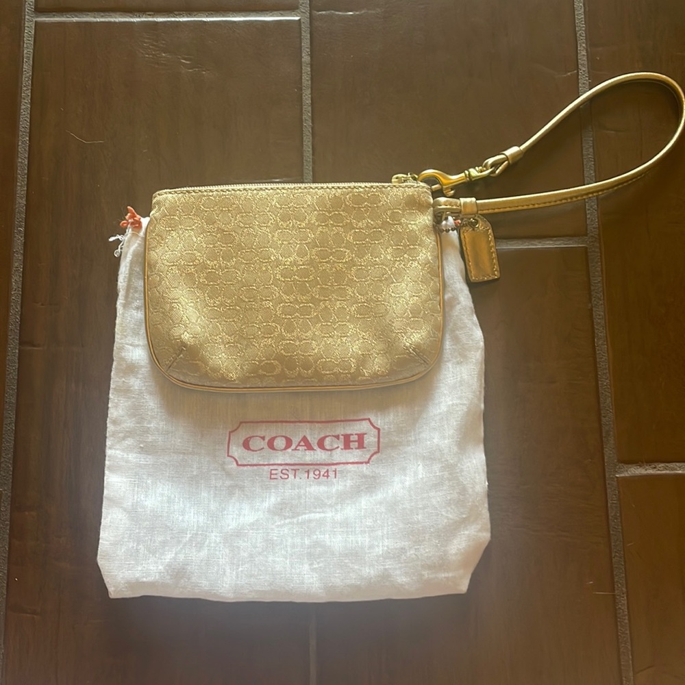 Gold coach wristlet